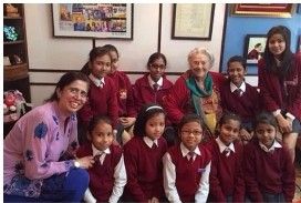 Marketing Strategy of Sandhar Technologies + group of school children with their principal and an official from STL