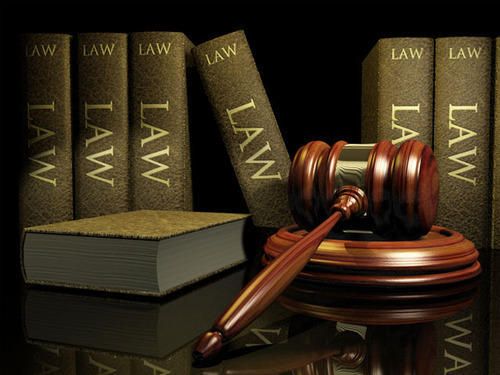 courses after BA - Image of a gavel next to a few books with the word 'law' written on each of them