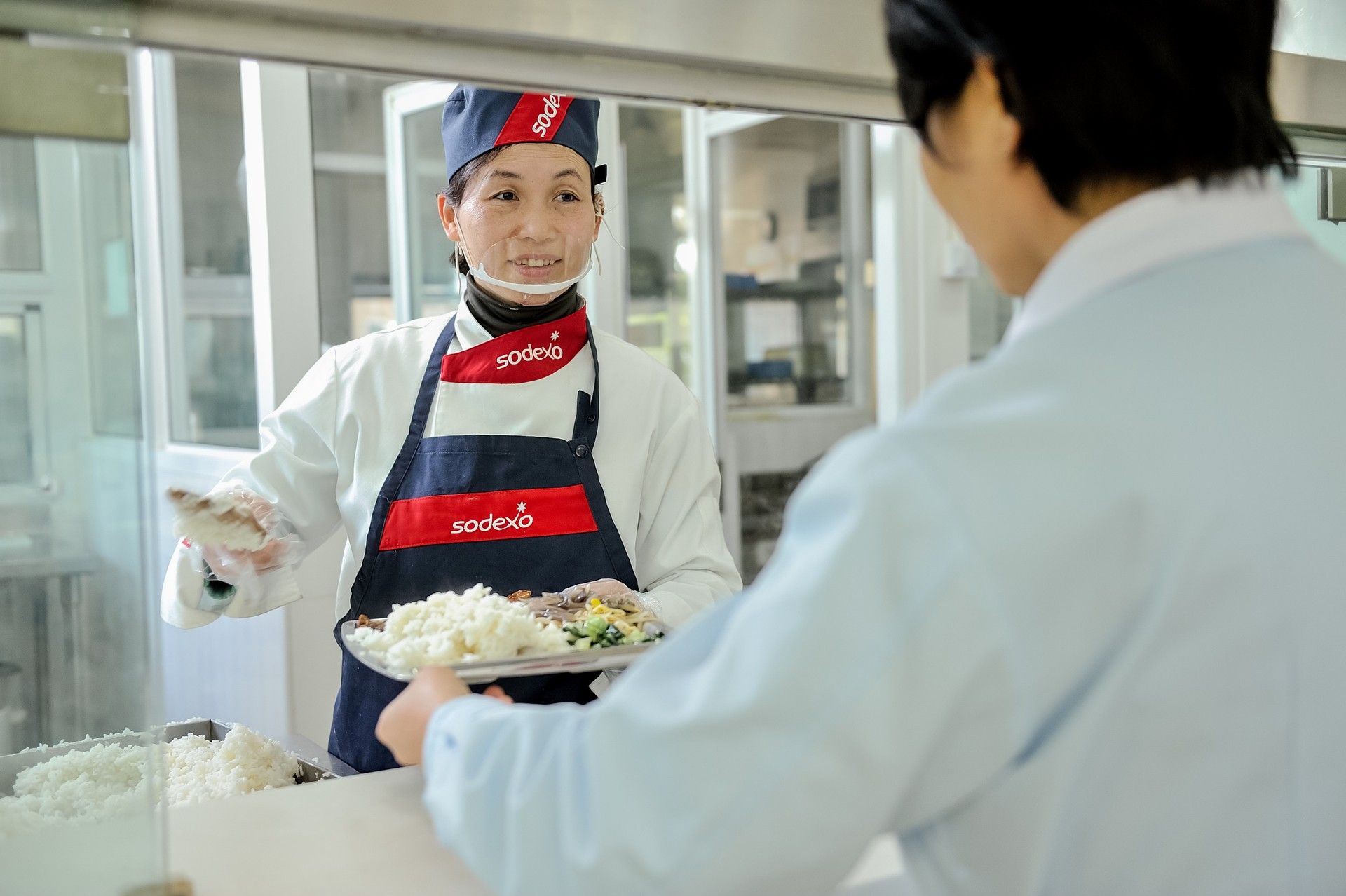 SWOT Analysis of Sodexo - Image of Sodexo Worker Serving Customer